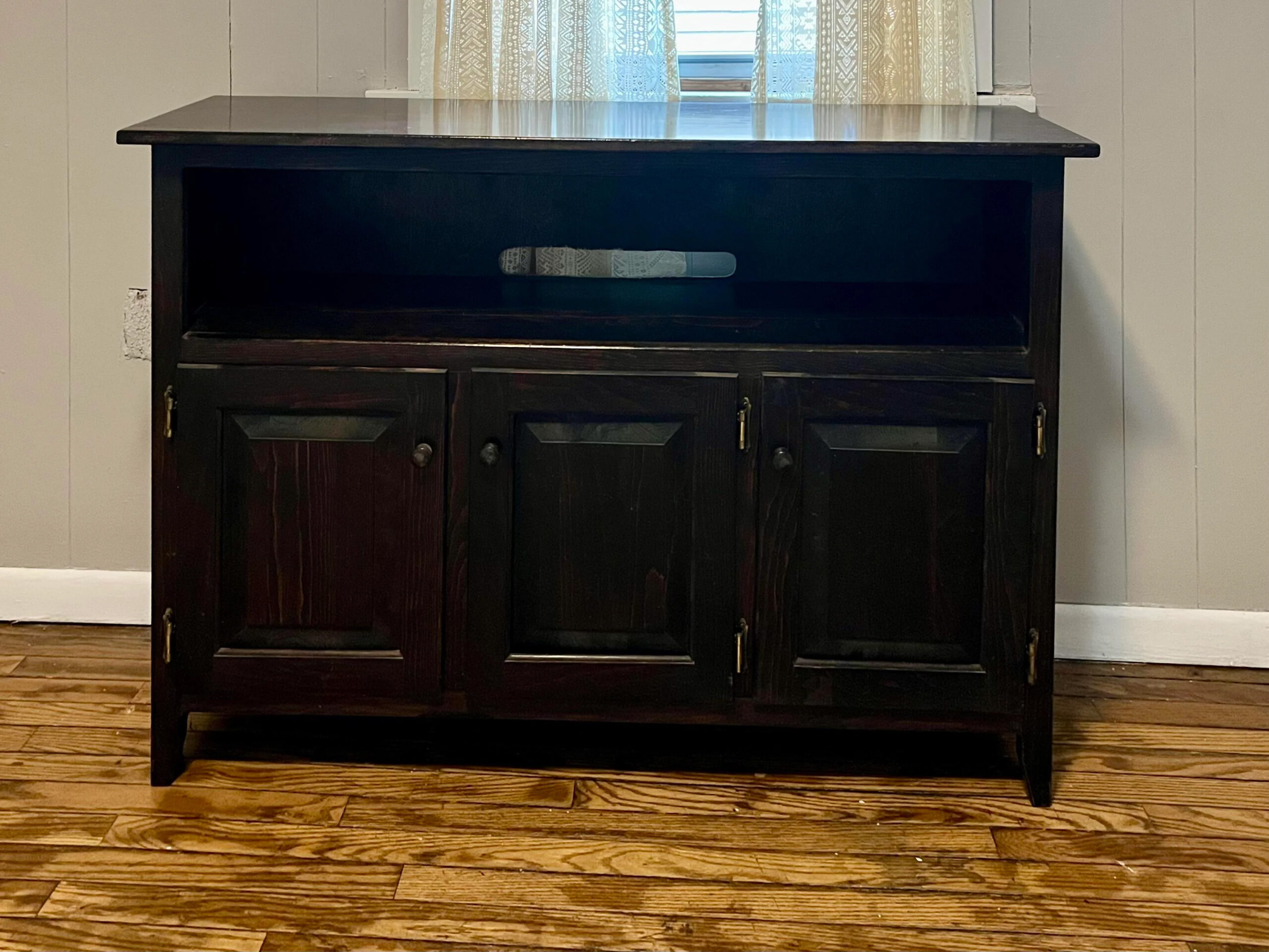 I’m not a fan of visible litterboxes – I turned an old TV stand into a hideaway