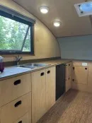 2022 custom Timberline towable from Homegrown Trailers is a tiny house and travel trailer hybrid with off-grid capabilities