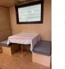 2022 custom Timberline towable from Homegrown Trailers is a tiny house and travel trailer hybrid with off-grid capabilities