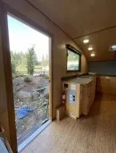 2022 custom Timberline towable from Homegrown Trailers is a tiny house and travel trailer hybrid with off-grid capabilities