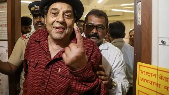 Veteran actor Dharmendra, 88, walked to the polling booth to cast his vote. (PTI)