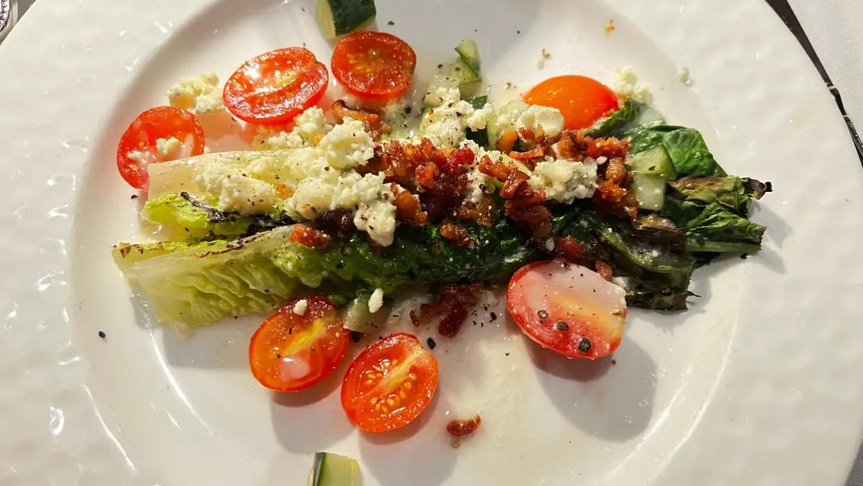 At The Nest in Jensen Beach, the charred romaine salad was enhanced by crispy bacon, heirloom tomatoes and cucumber drizzled with a tangy gorgonzola vinaigrette.