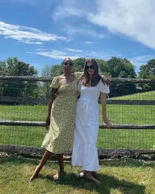 women wearing summer dresses in a field