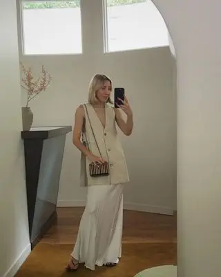 @angelafink wearing a waistcoat and skirt