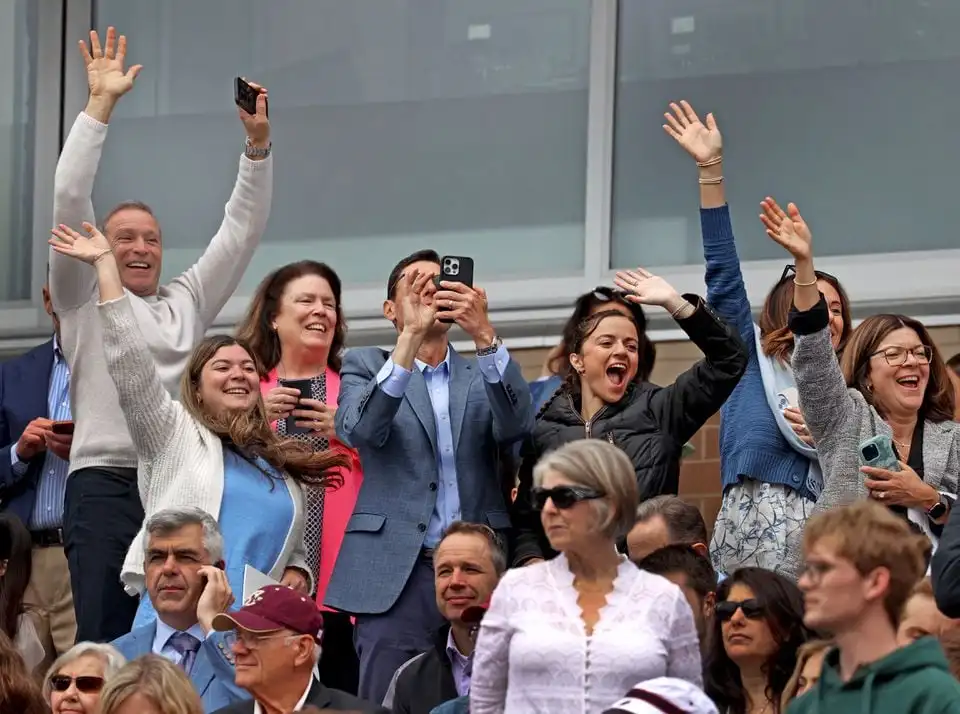 People cheered graduates during the Boston College commencement ceremony at Alumni Stadium.
