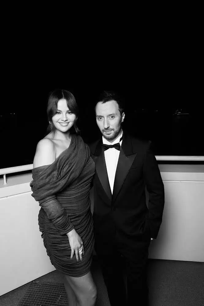 Image may contain Anthony Vaccarello Clothing Formal Wear Suit Tuxedo Face Head Person Photography and Portrait