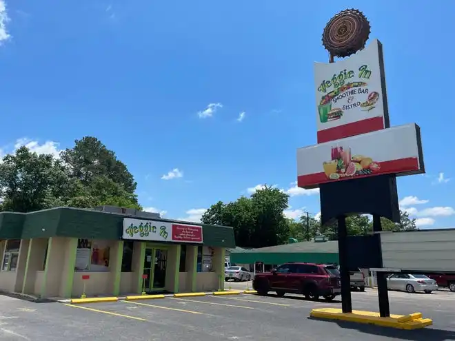 The sign for Veggie In on Peach Orchard Road still retains the shape of the restaurant's original Maryland Fried Chicken sign from 1968.