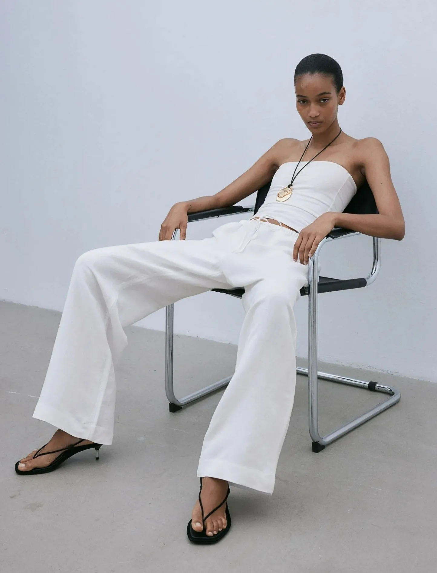 Mia praises H&M's white linen trousers for not being see-through