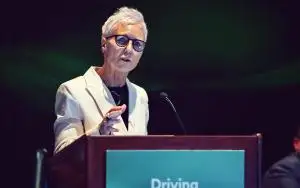 Woman speaks at lectern