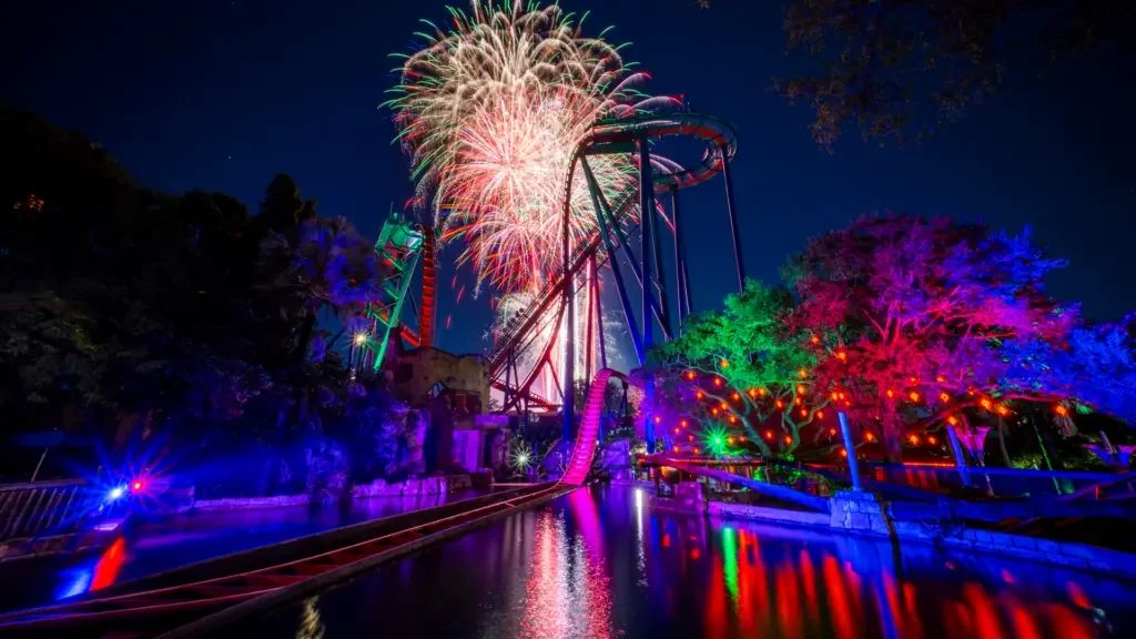 a fireworks display at a theme park