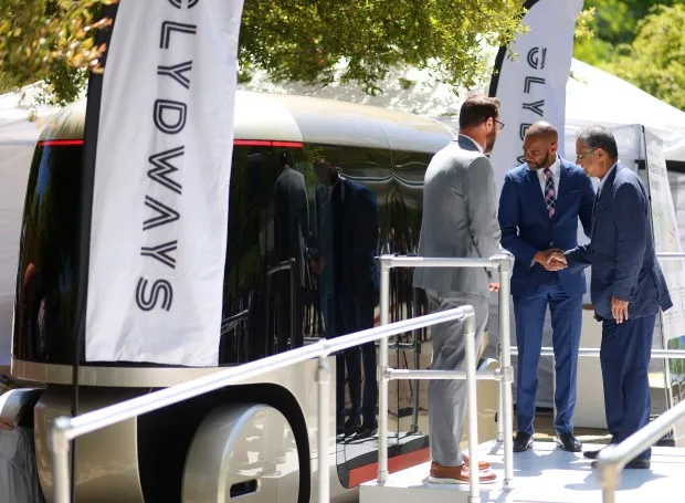 Tim Haile, left, Executive Director of the Contra Costa Transportation Authority, Antioch Mayor Lamar Thorpe, center, and Glydways CEO Gokul Hemmady, right, unveil a Glydcar at the 9th Annual Redefining Mobility Summit on Tuesday, May 7, 2024, in San Ramon, Calif. The new autonomous cars will move riders in dedicated lanes across a 28 mile system connecting four East Contra Costa County areas. (Aric Crabb/Bay Area News Group)