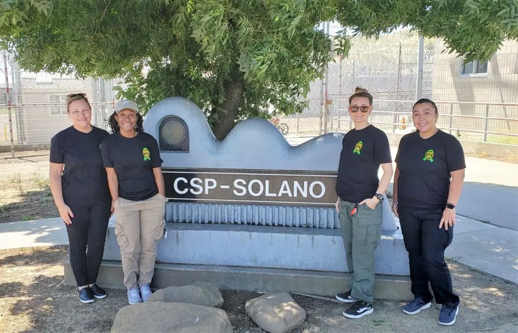 CSP-Solano sign with staff wearing mental health awareness shirts.