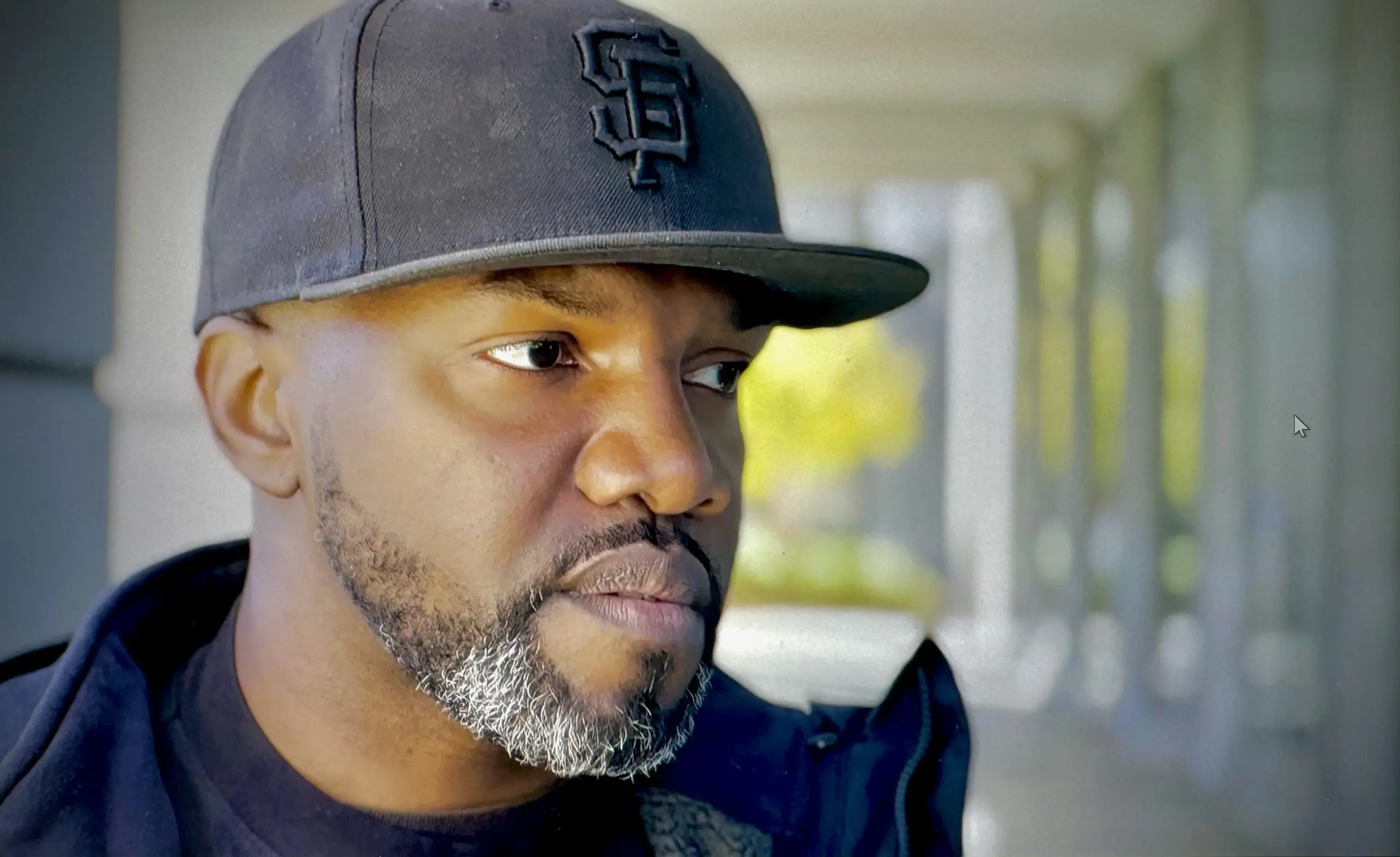 Parole Agent Richardson wearing a black baseball cap.