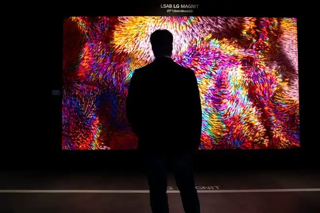 May 21, 2024; Englewood Cliffs, New Jersey, USA; A man is silhouetted against a 217-inch UHD-quality MAGNIT display at the LG's new innovation center on Tuesday.