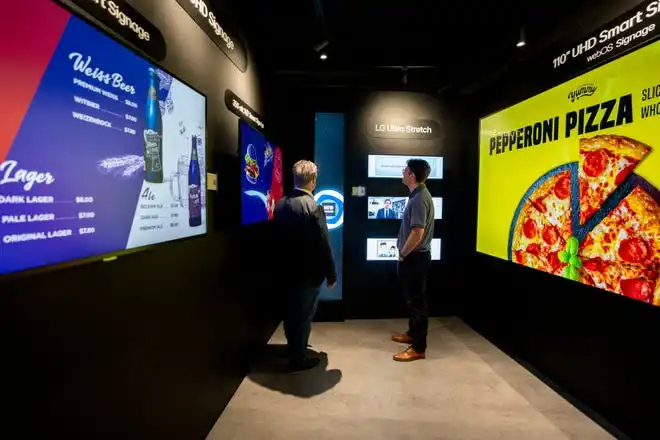 May 21, 2024; Englewood Cliffs, New Jersey, USA; Paul Vitellaro and Tom Terzulli look at signage at LG's new innovation center on Tuesday.