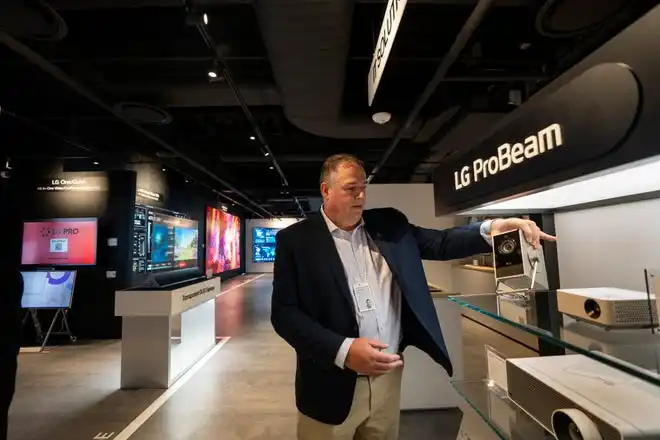 May 21, 2024; Englewood Cliffs, New Jersey, USA; David Bacher, head of marketing at LG Business Solutions USA, holds a ProBeam projector at LG's new innovation center on Tuesday.