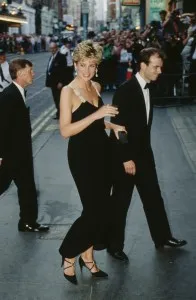 Princess Diana wears a black low cut evening dress as she arrives at the London Coliseum Theatre to see The Taming of the Strew in London, England, 24th June 1991.(Photo by Tim Graham Photo Library via Getty Images)