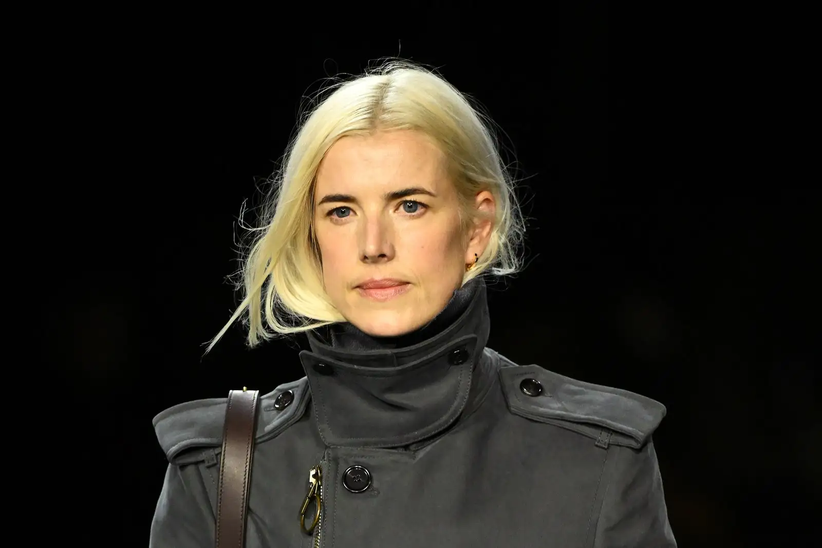 Image may contain: Agyness Deyn, Clothing, Coat, Overcoat, Blonde, Hair, Person, and Trench Coat