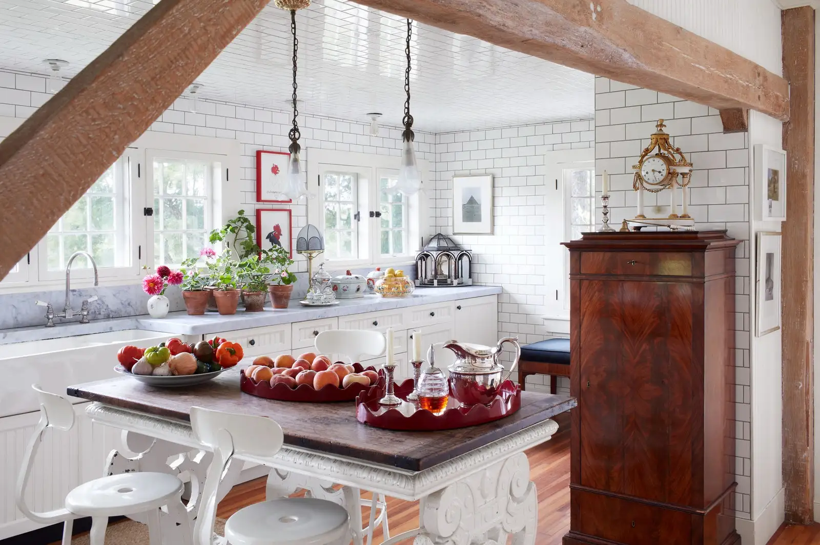 The kitchen is clad in Cottage Tile in Dover White by Waterworks. 18thcentury Italian painted library table Austrian...