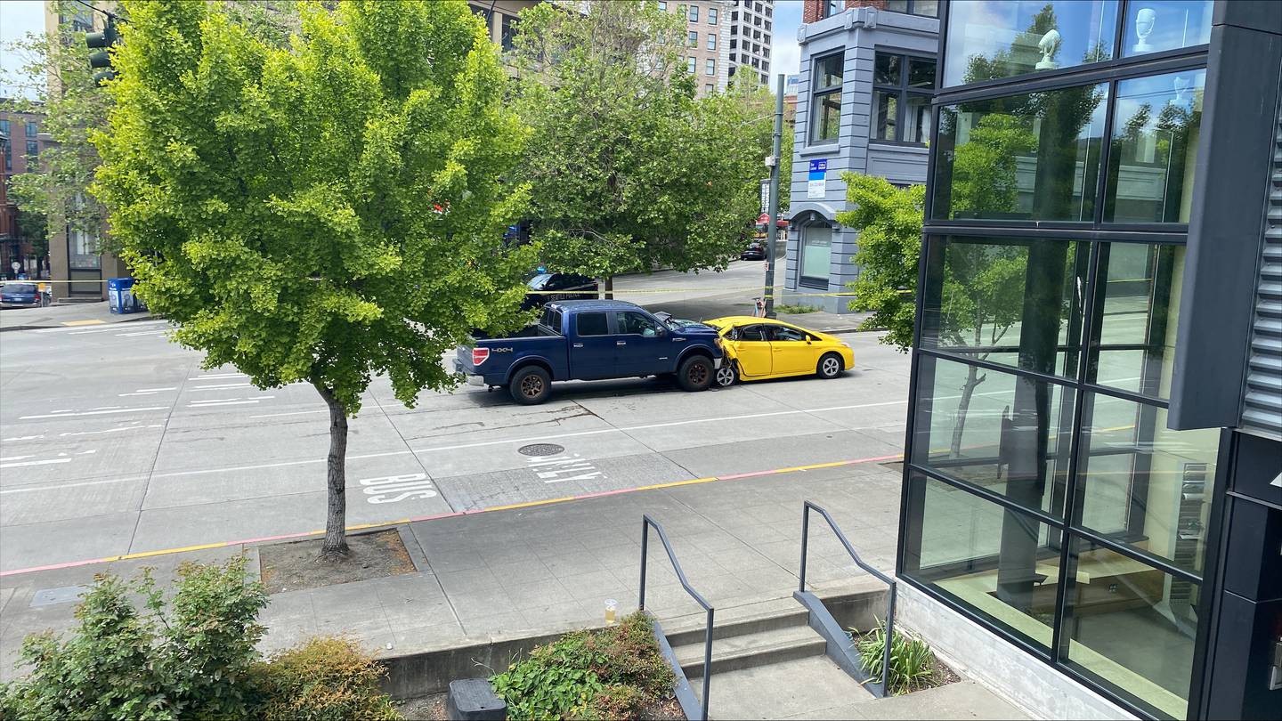 Road closed, two in critical condition following two-car crash in downtown Seattle