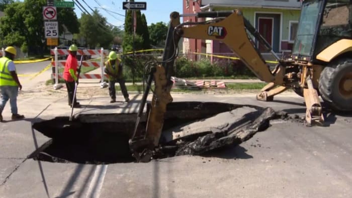 Driver escapes unharmed as sinkhole engulfs car in SW Detroit