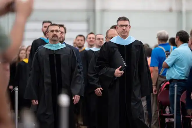 York County School of Technology seniors enter their commencement ceremony at UPMC Arena on Thursday, May 23, 2024.