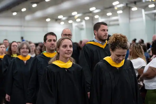 York County School of Technology seniors enter their commencement ceremony at UPMC Arena on Thursday, May 23, 2024.