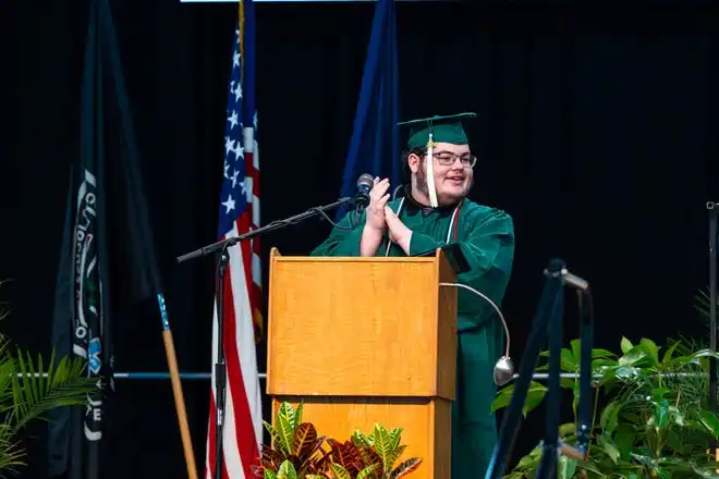 York Tech senior Ian Morris delivers a speech to his class about perceptions, acceptance, and breaking the status quo during the commencement ceremony at UPMC Arena on Thursday, May 23, 2024.