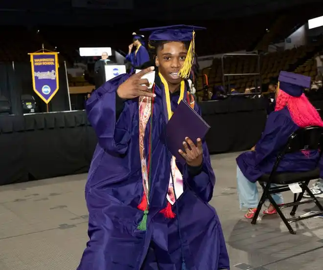 Washington High School of Information Technology student Terrence Jackson smiles after receiving his diploma during the graduation ceremony on Thursday May 23, 2024 at the UWM Panther Arena in Milwaukee, Wis.