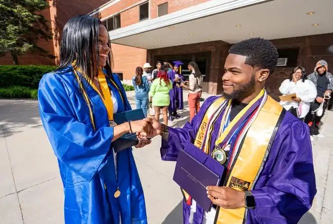 (Right) Washington High School of Information Technology graduate Romon Price celebrates with sibling (left) Ta’Honesty Mashrea, a 2024 Ronald Reagan High School graduate, after the graduation ceremony on Thursday May 23, 2024 at the UWM Panther Arena in Milwaukee, Wis.