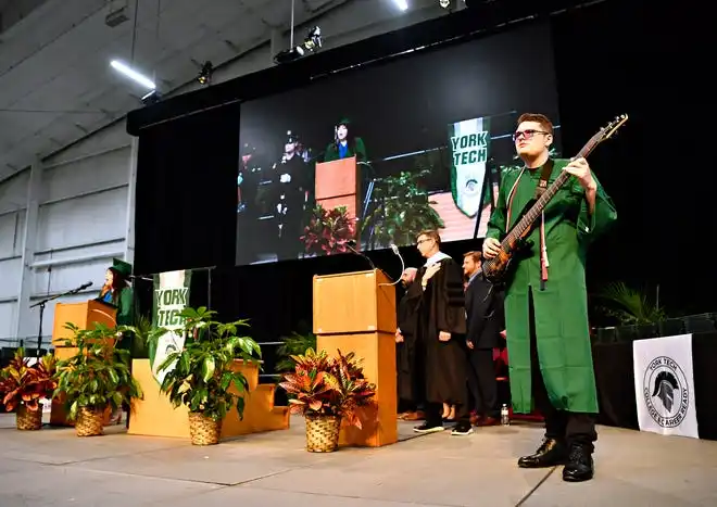 The National Anthem is performed by graduates Clara Kisielnicki, left, and on base, Cole Saylor, at right, during the York County School of Technology Graduation Ceremony at York Expo Center in West Manchester Township, Thursday, May 23, 2024. (Dawn J. Sagert/The York Dispatch)
