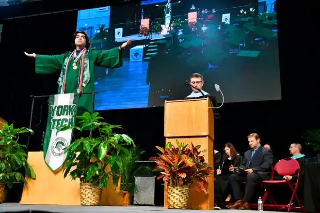 President of the Class of 2024 and Valedictorian Jonathan Hernández directs his classmates during the York County School of Technology Graduation Ceremony at York Expo Center in West Manchester Township, Thursday, May 23, 2024. (Dawn J. Sagert/The York Dispatch)