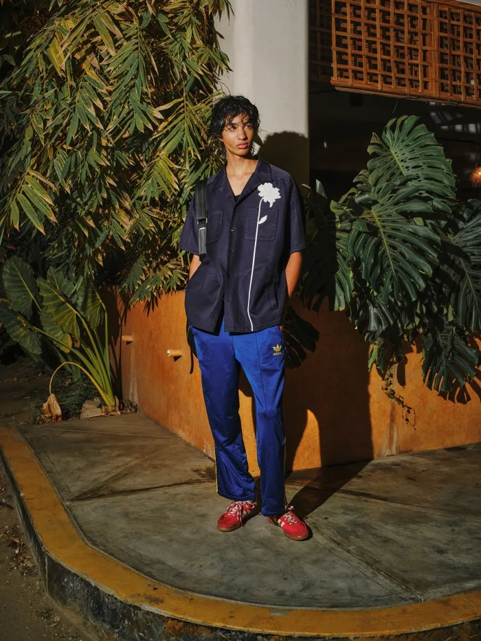 Model and fashion student Emilio Valladares, 18. Emilio wears Valentino cotton bowling shirt, £2,850. Adidas recycled polyester trousers, £65. Adidas x Wales Bonner suede Samba shoes, $280. Bag, Emilio’s own