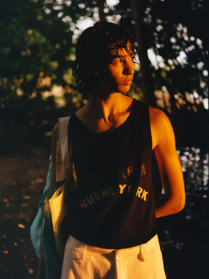 Emilio wears Willy Chavarria cotton tank top, £201. Zegna linen and cotton trousers, £1,704. Bag, stylist’s own, from a selection at the street markets in Oaxaca City