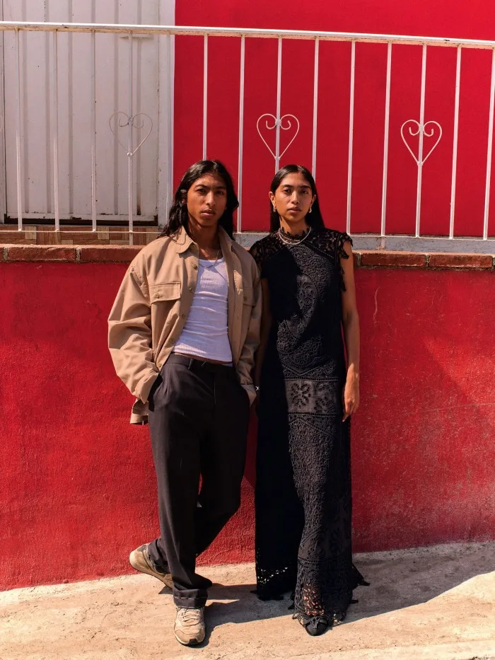 Narayan (left) wears Dickies By Willy Chavarria cotton-mix work shirt, £175. Hanes cotton tank top, $14.40. Brioni wool Journey trousers, £990. David Yurman sterling-silver necklace, $1,350. Nike shoes, stylist’s own. Zentyatze wears Ulla Johnson linen Flora dress, £1,187. Chanel leather and grosgrain shoes (just seen), £1,075. Annika Inez sterling-silver hoop earrings, £239, necklace, £305, and bracelet (just seen), £465