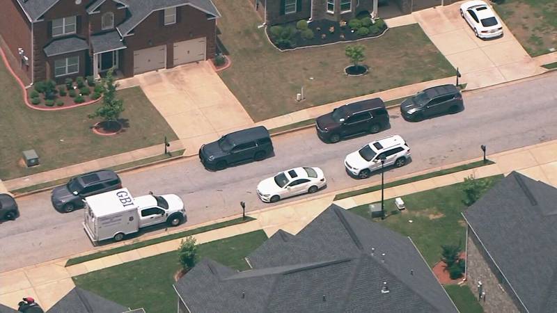 Woman found shot to death after car crashes in DeKalb County