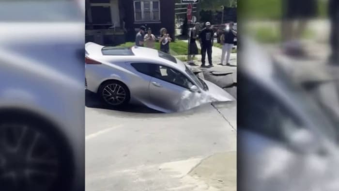 Sinkhole suddenly swallows car driving on Detroit side street