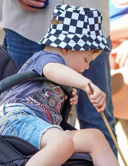 Silas Wilhoit wears his checkered flag bucket hat on Friday, May 24, 2024, during Carb Day ahead of the 108th running of the Indianapolis 500 at Indianapolis Motor Speedway.