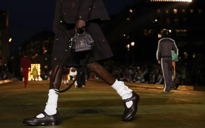 PARIS, FRANCE - JUNE 20: (EDITORIAL USE ONLY - For Non-Editorial use please seek approval from Fashion House) A model, bag and shoe details, walks the runway during the Louis Vuitton Menswear Spring/Summer 2024 show as part of Paris Fashion Week on June 20, 2023 in Paris, France. (Photo by Peter White/Getty Images)