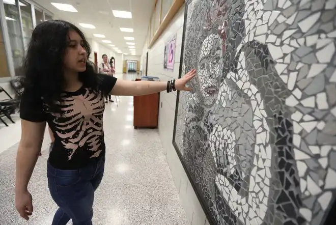 Angela Vazquez, one of the five students who worked on the mosiac, talked about her and her classmates worked how some areas of the face was detailed work to make sure they got the features right. Edison Career and Technology High School unveiled their Ladies Ladders & Lenses mosiac mural at the school. The other students who worked on it but were not at the unveiling were LaJour Dunlop, Yaidymar Flores, Amari Coley-Henderson, A’Zariah Williams and CeCe Jones,. The students area construction and design students at the school, and had made the mosaic to honor the Black Rosies of World War II. This is a 10 year project to showcase pioneering women and will be displayed in the main hallway at the school.