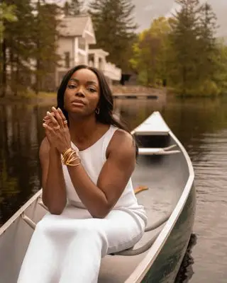 Woman wearing jewelry on a canoe