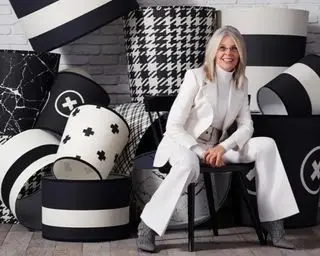 diane keaton in front of her black and white lampshade collection