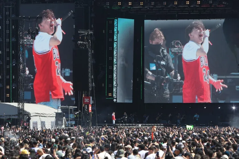 Xavi sings in front of hundreds at the Sueños Music Festival wearing a Bulls jersey