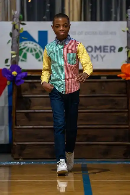 Placide Imona Zawako walks down the runway showing off his outfit during the Newcomer Academy Fashion Show on Friday, April 19, 2024.