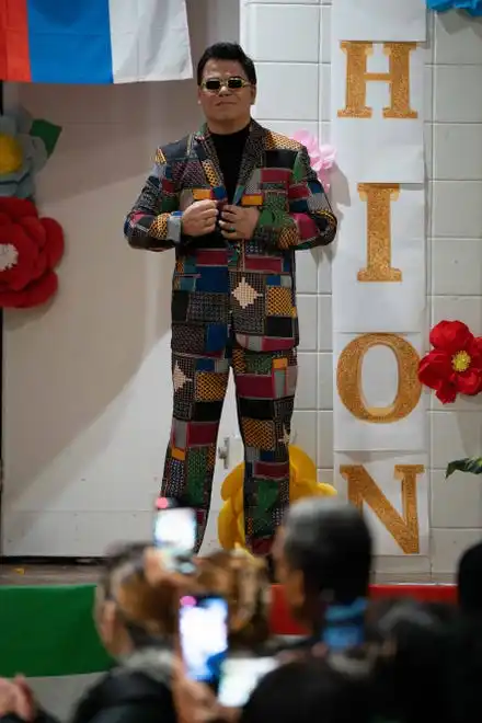 Joel Giro shows off his outfit at the Newcomer Academy Fashion Show on Friday, April 19, 2024.