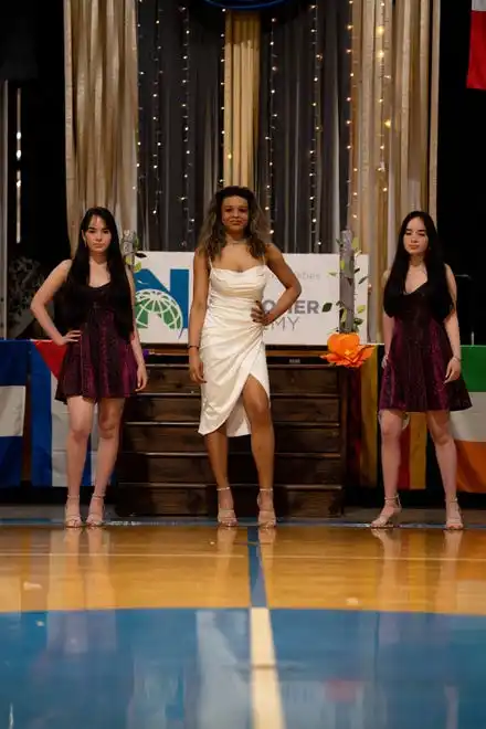 Yanara Ferreira Tito and sisters Keyla and Sheyla Figueredo Rodriguez show off their outfits at the Newcomer Academy Fashion Show on Friday, April 19, 2024.