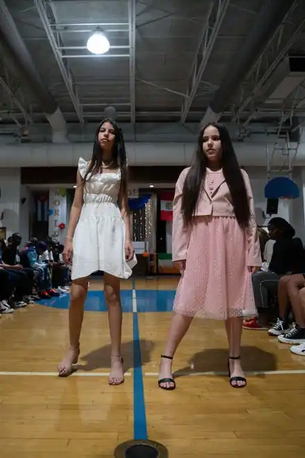 Olga Lopez Vargas and Saylin Espinosa Castellano show off their outfits at the Newcomer Academy Fashion Show on Friday, April 19, 2024.