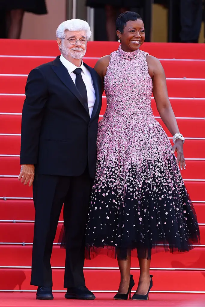 Mellody Hobson and George Lucas attend the Red Carpet of the closing ceremony at the 77th annual Cannes Film Festival 