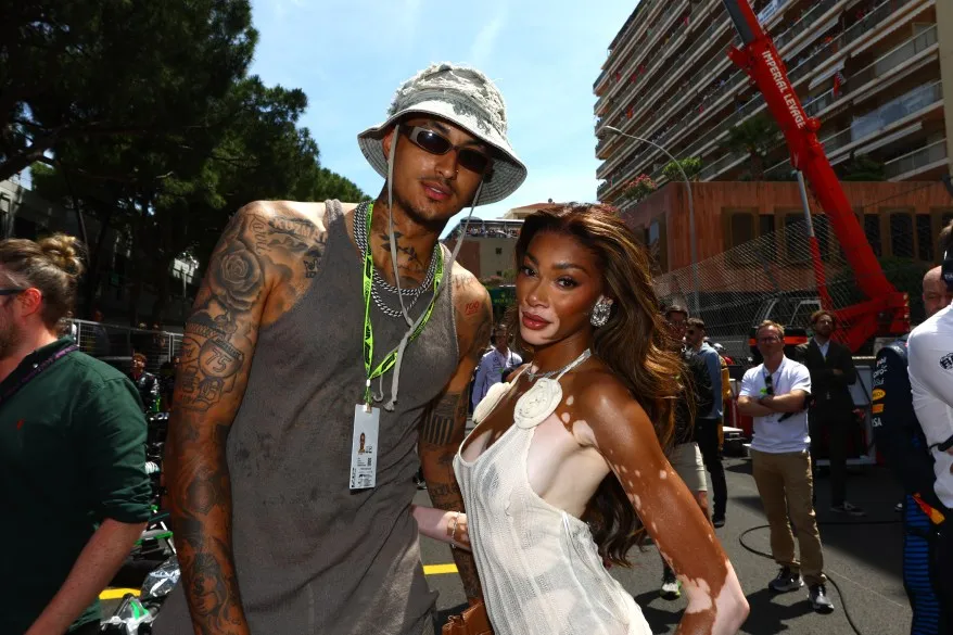 Kyle Kuzma and Winnie Harlow pose for a photo on the grid prior to the F1 Grand Prix of Monaco at Circuit de Monaco on May 26, 2024 