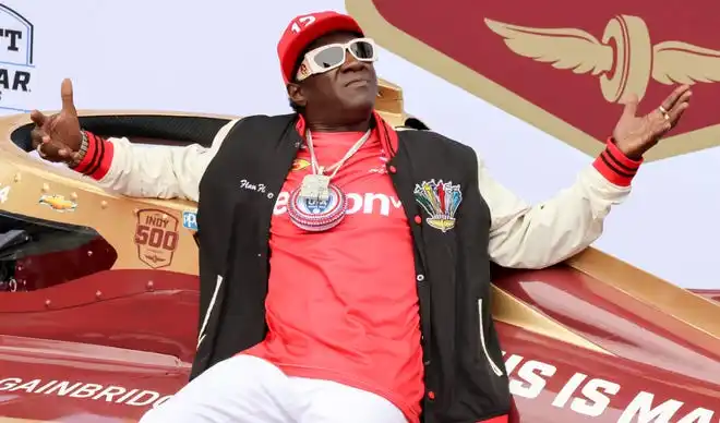 Flavor Flav sits on an IndyCar on Sunday, May 26, 2024, ahead of the 108th running of the Indianapolis 500 at Indianapolis Motor Speedway.